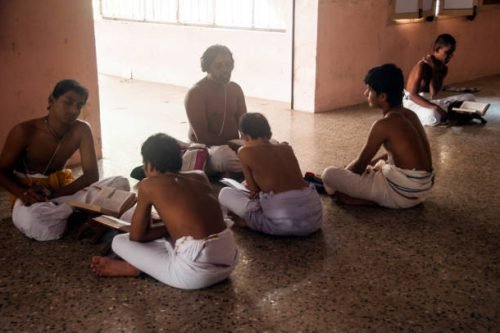 free gurkul KANCHIPURAM, TAMIL NADU, INDIA, December 2, 2017 : Brahmin Student taking religious education in the traditional Brahmin school at Varadaraja Perumal Temple.